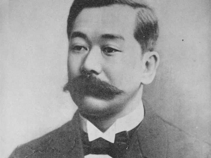 Black and white portrait of Jigoro Kano in formal clothing